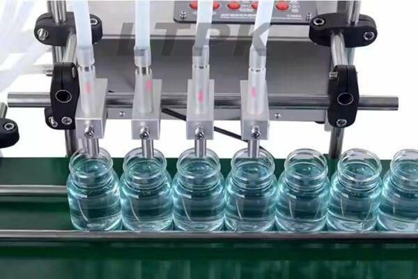 ⁦آلة تعبئة زجاجات المياه شبه الأوتوماتيكية ذات 4 فوهات للمشروبات السائلة والزيوت العطرية وصلصة الصويا والخل⁩ - الصورة ⁦3⁩